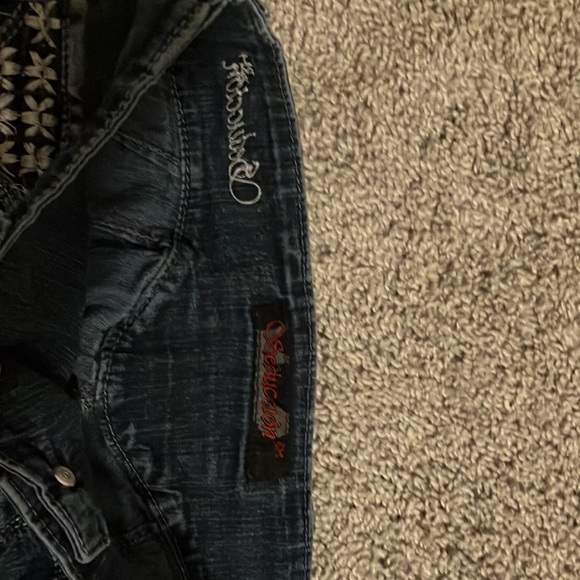 Two pairs of jeans.Both are brand new with no tags.Have cool designs aswell. - Picture 7 of 8